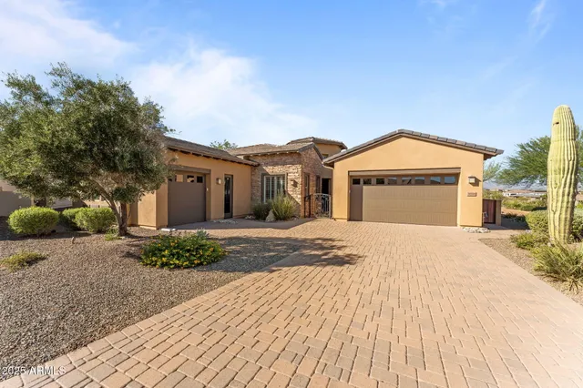 a view of a house with backyard sitting area and swimming pool