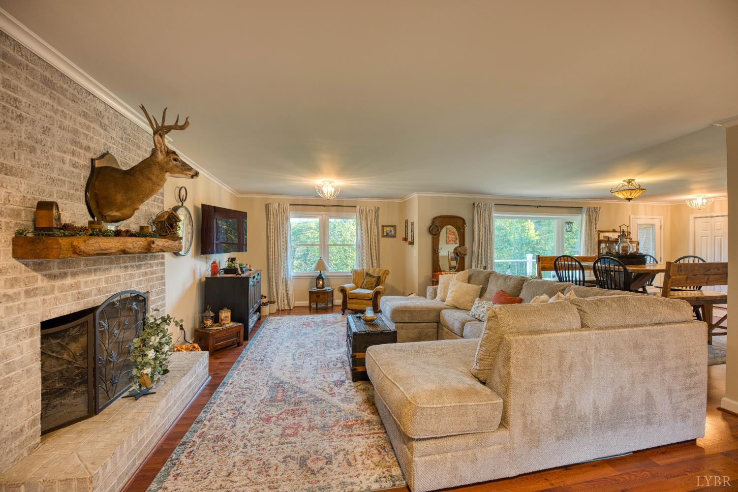 2287 Johnson Creek Road Evington, VA 24550 - Photo 13 of 70 a living room with furniture a fireplace and a flat screen tv