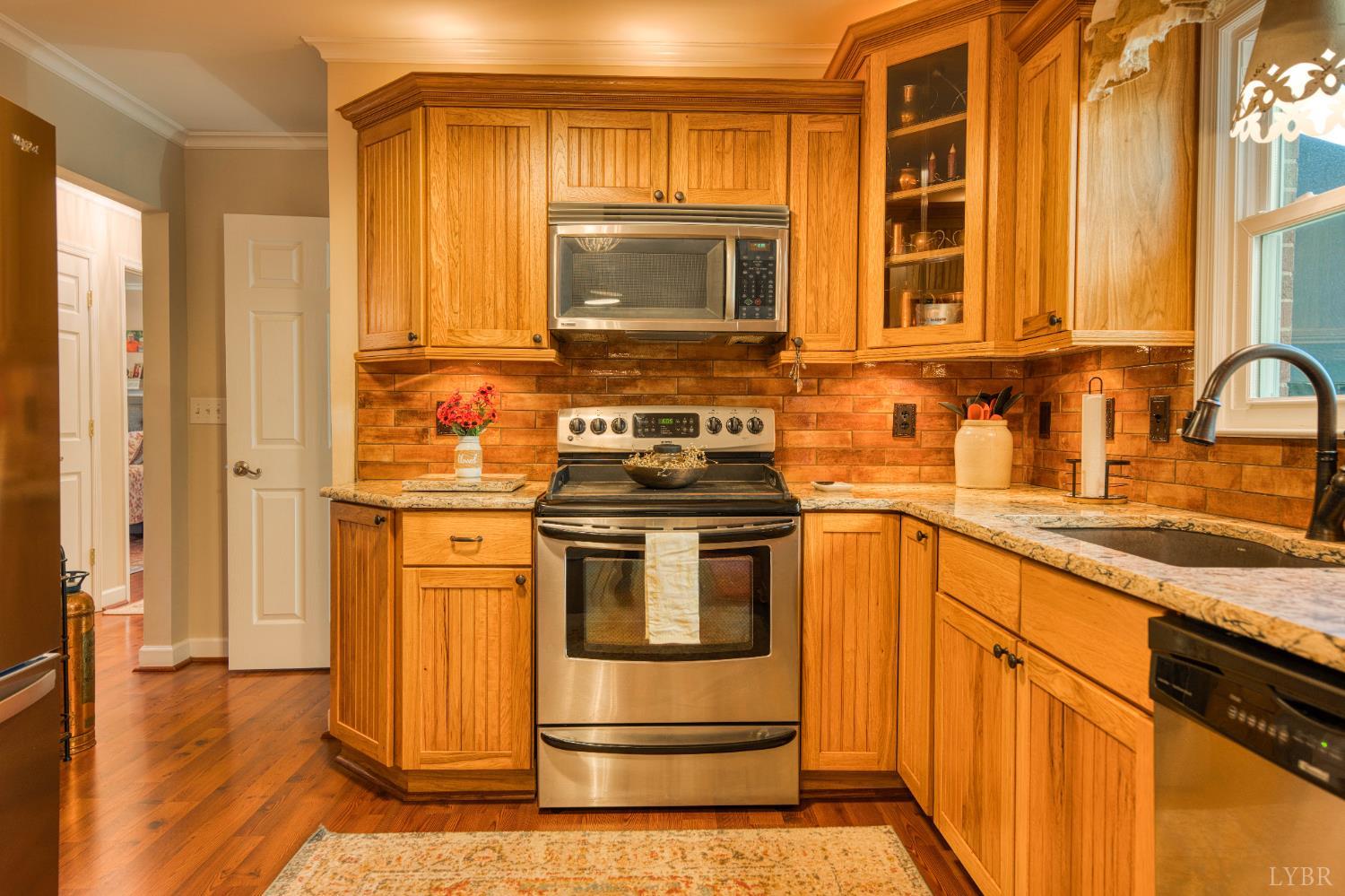 2287 Johnson Creek Road Evington, VA 24550 - Photo 16 of 70 a kitchen with stainless steel appliances granite countertop a stove and a sink