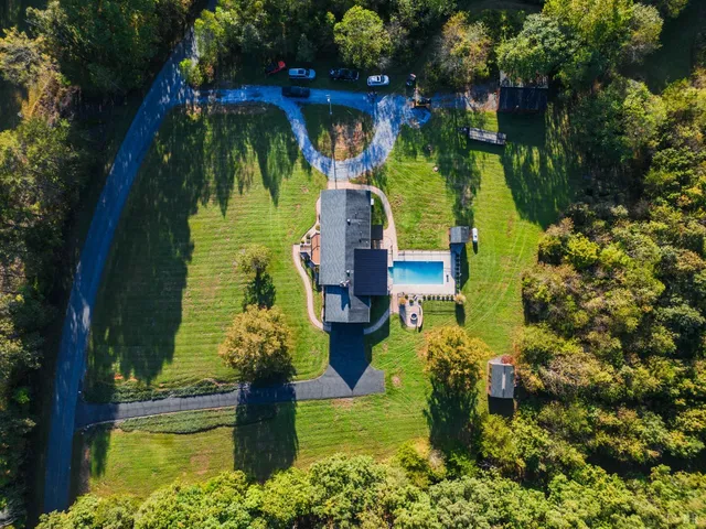 a view of a swimming pool with a patio