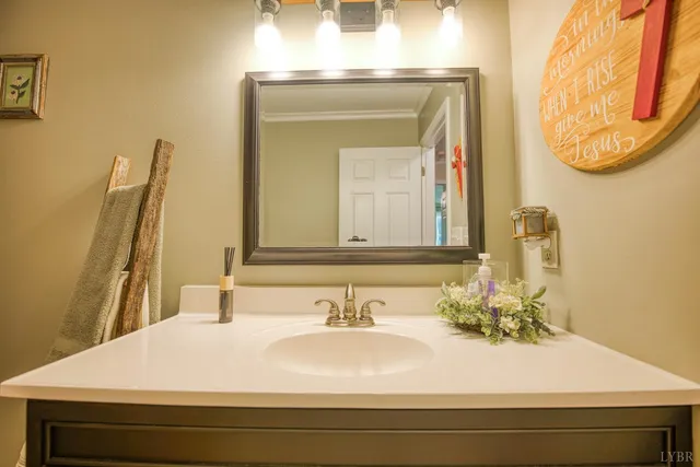 a bathroom with a sink a mirror and a shower