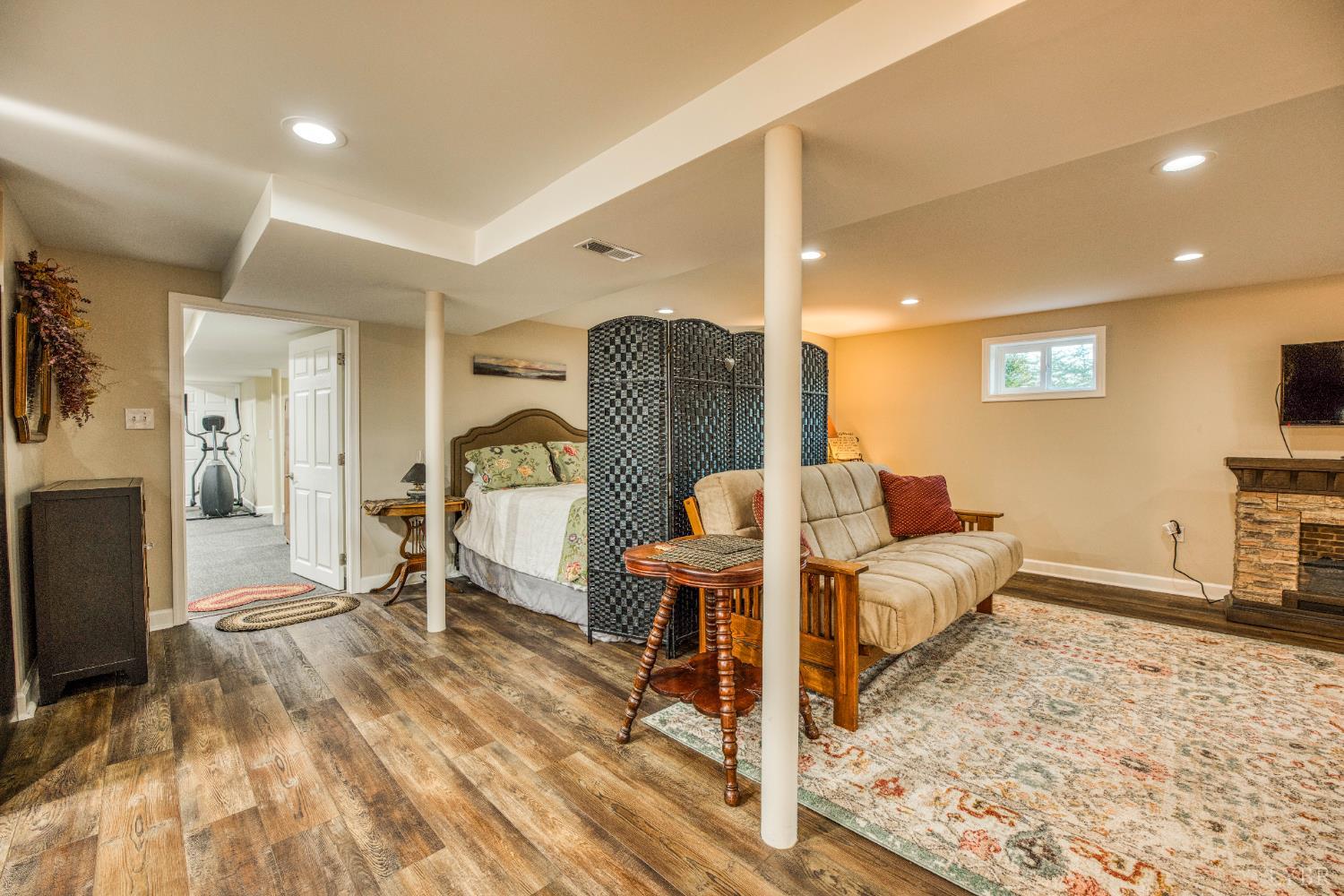 2287 Johnson Creek Road Evington, VA 24550 - Photo 33 of 70 a living room with furniture a wooden floor and a flat screen tv