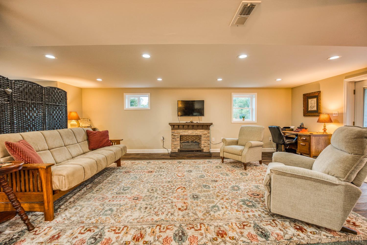 2287 Johnson Creek Road Evington, VA 24550 - Photo 34 of 70 a living room with furniture window and a fireplace