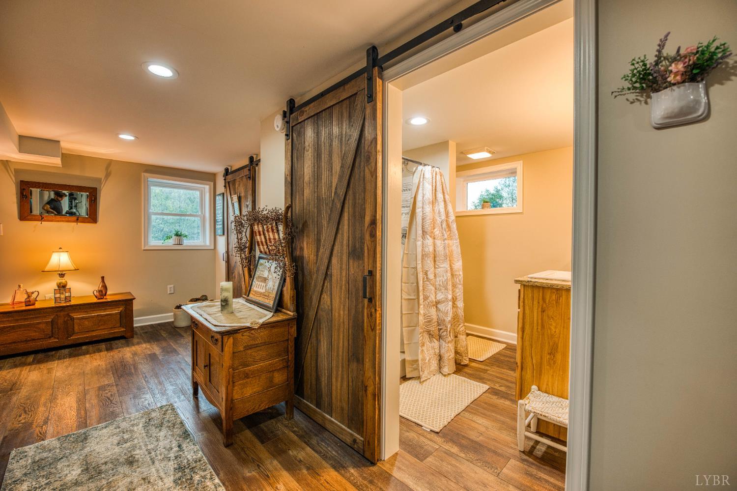 2287 Johnson Creek Road Evington, VA 24550 - Photo 39 of 70 a bathroom with a sink a mirror and a shower
