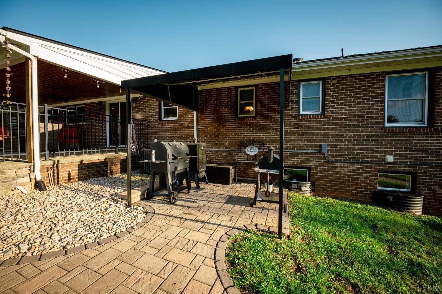 2287 Johnson Creek Road Evington, VA 24550 - Photo 50 of 70 a view of a chairs and a table in a patio