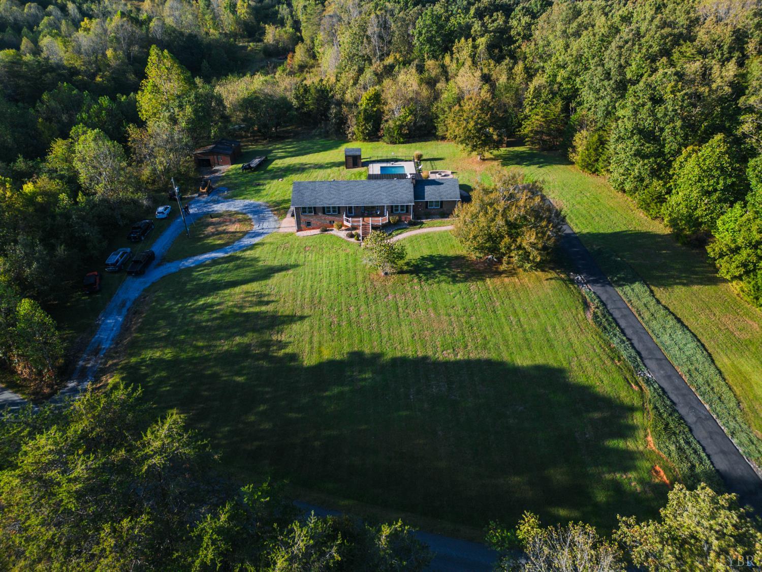2287 Johnson Creek Road Evington, VA 24550 - Photo 60 of 70 a backyard of a house with a garden