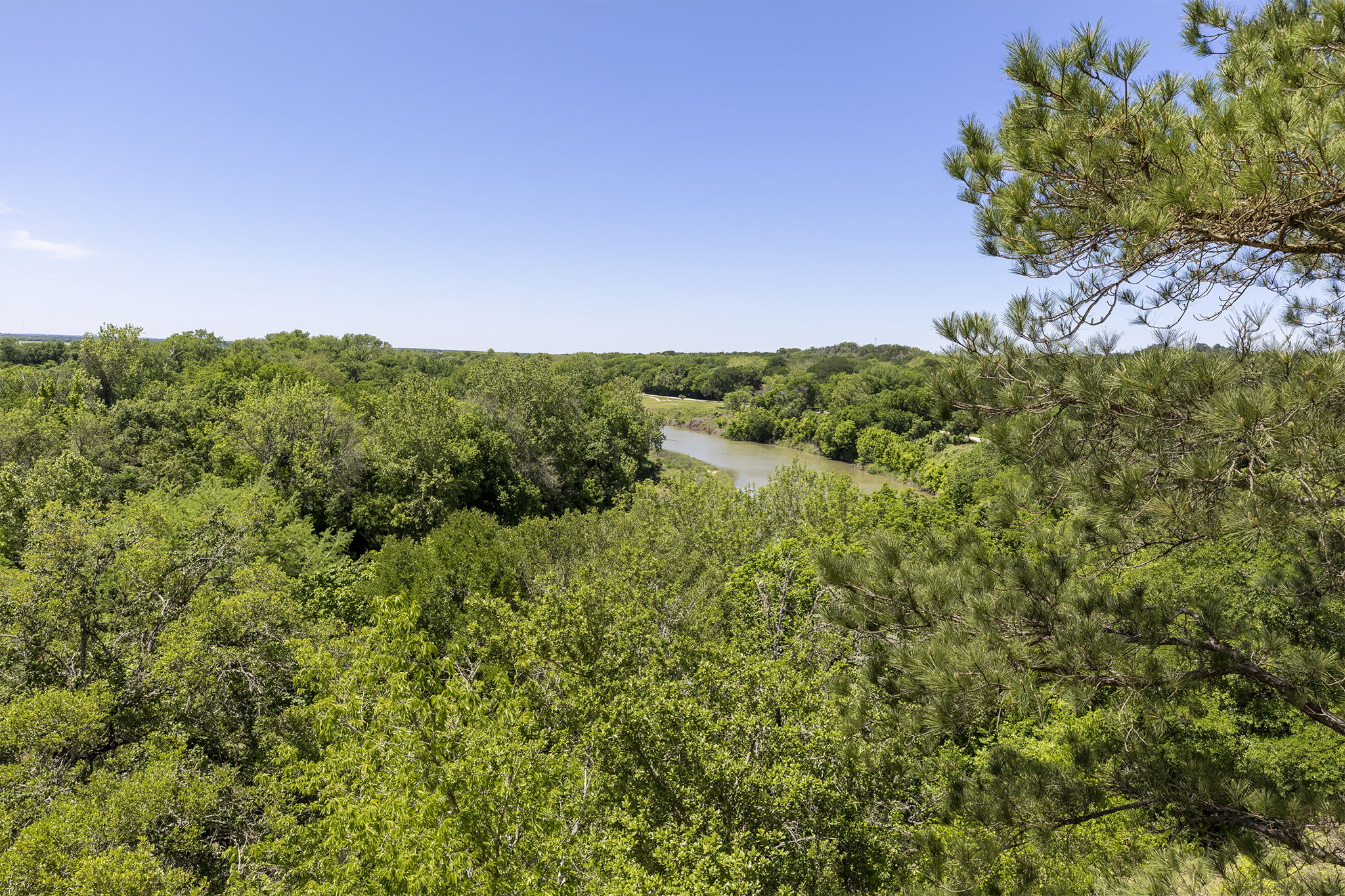 Tbd Hula Lane Bastrop, TX 78602 - Photo 17 of 22 View of wooded area featuring a water view