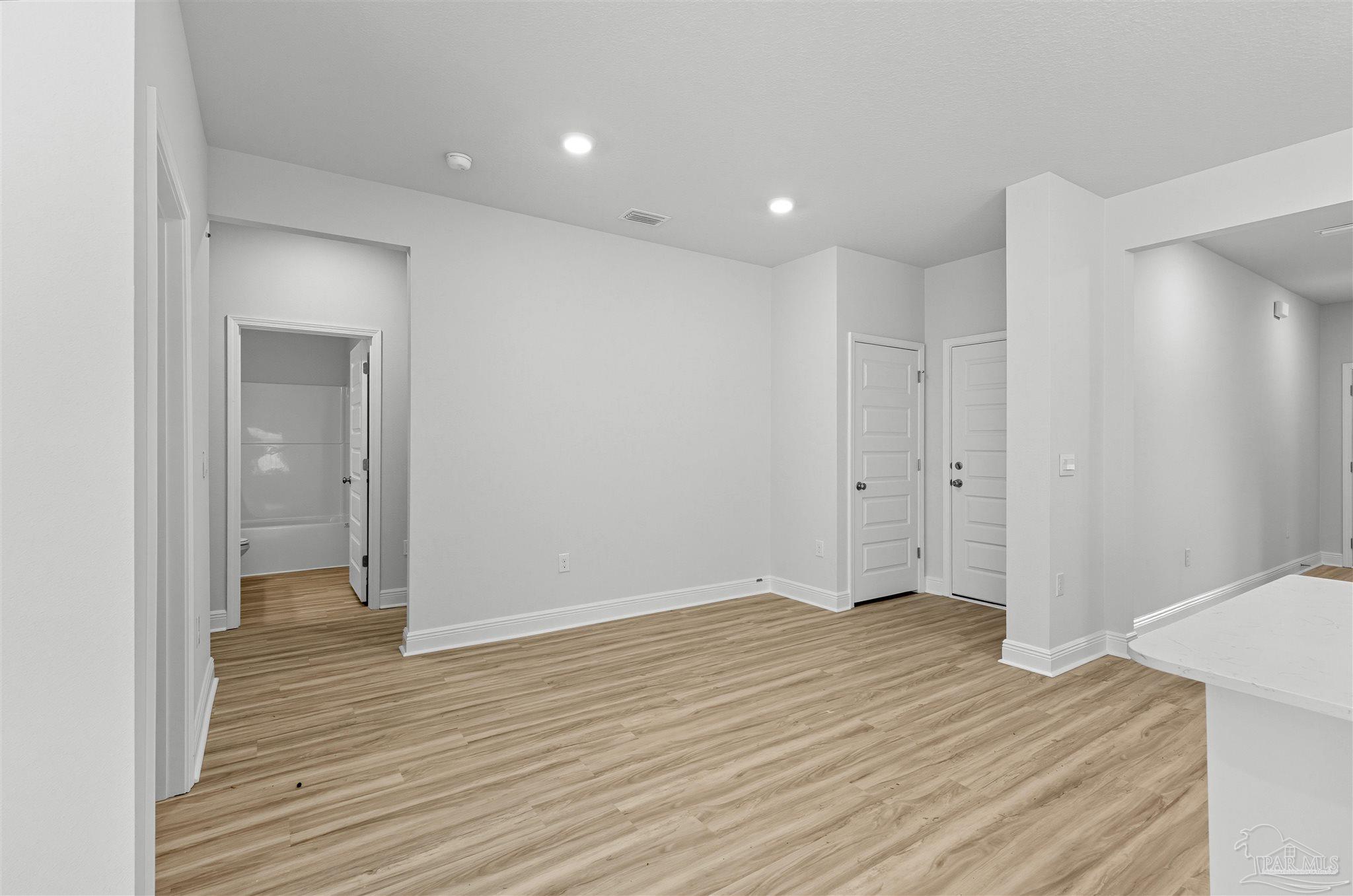 3551 Fallschase Boulevard Pensacola, FL 32526 - Photo 23 of 31 a view of an empty room with wooden floor