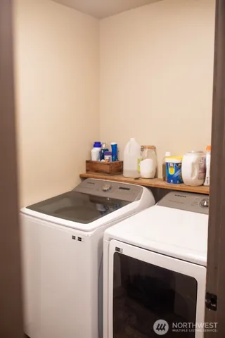 a utility room with dryer and washer