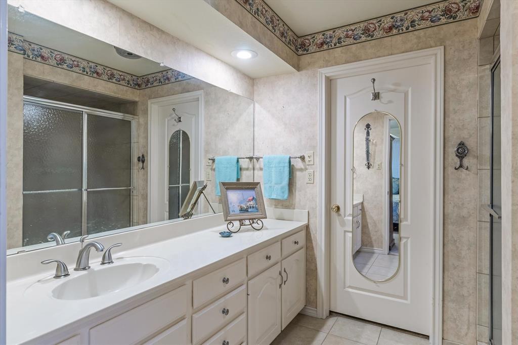 114 Granada Square Canton, TX 75103 - Photo 12 of 23 a bathroom with a double vanity sink and mirror