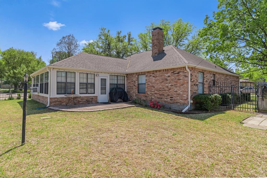 114 Granada Square Canton, TX 75103 - Photo 20 of 23 a view of a house with a yard patio and fire pit