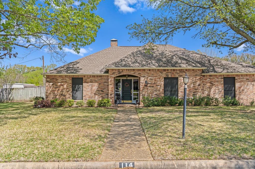 114 Granada Square Canton, TX 75103 - Photo 23 of 23 a front view of a house with a garden