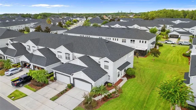 an aerial view of a house with a garden