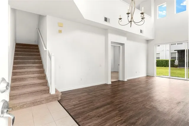 a view of an entryway with wooden floor