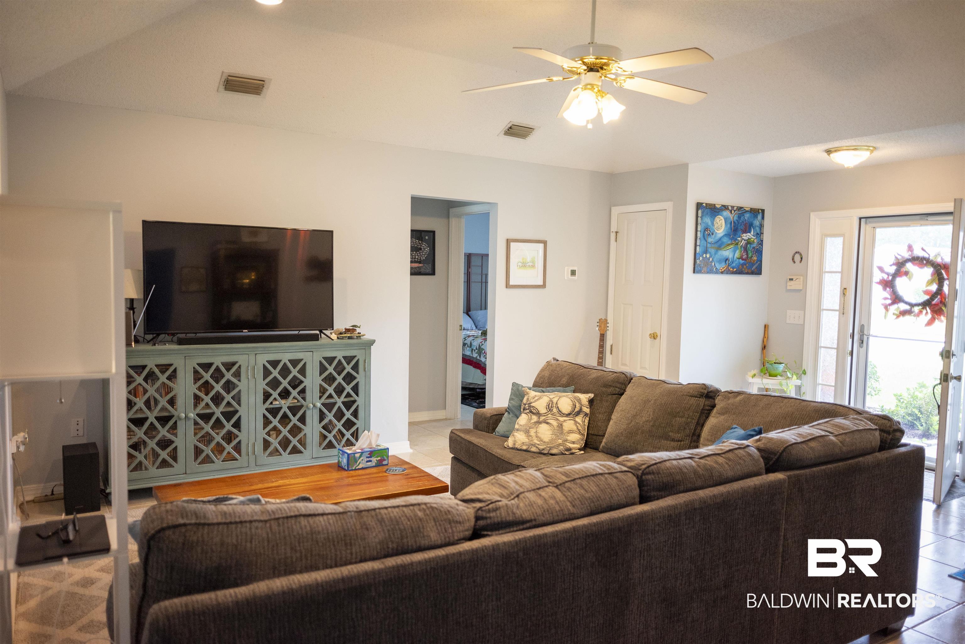 808 Wisteria Lane Foley, AL 36535 - Photo 4 of 19 Tiled living room with ceiling fan