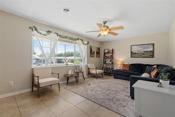 a living room with furniture and a large window
