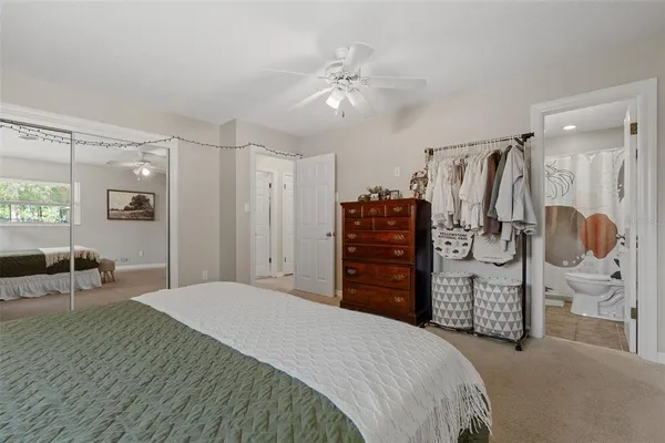 a bedroom with a bed and walk in closet