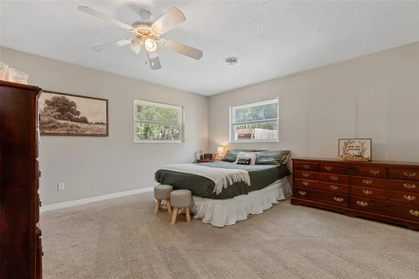 a bed room with furniture and a window