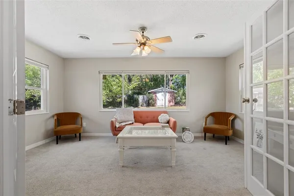 a living room with furniture and a large window
