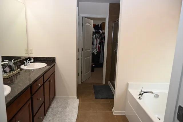 a utility room with sink dryer and washer
