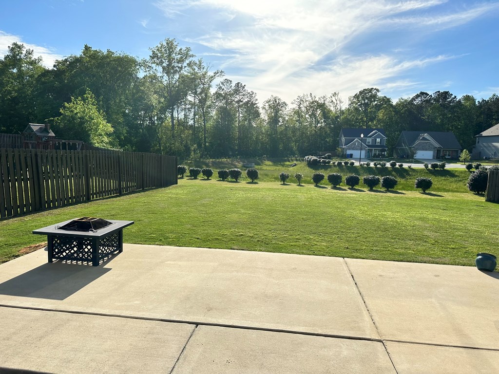 7279 Double Pine Drive Midland, GA 31820 - Photo 25 of 26 a view of a backyard with sitting area