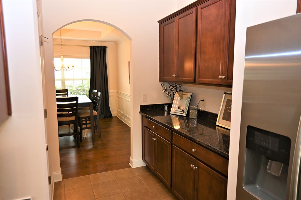 7279 Double Pine Drive Midland, GA 31820 - Photo 6 of 26 a kitchen with a refrigerator and a stove top oven