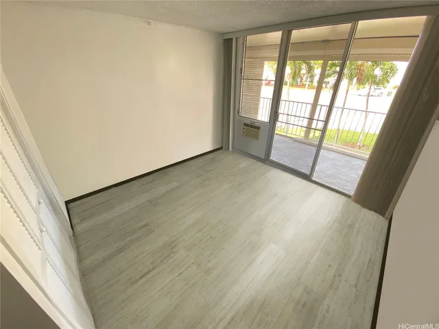 an empty room with wooden floor