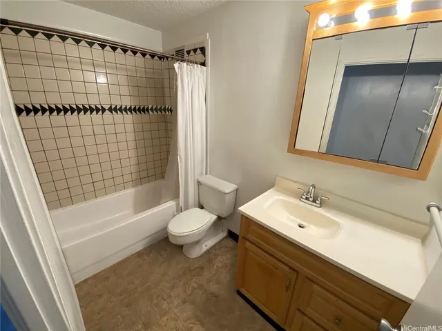 a bathroom with a toilet and a bathtub