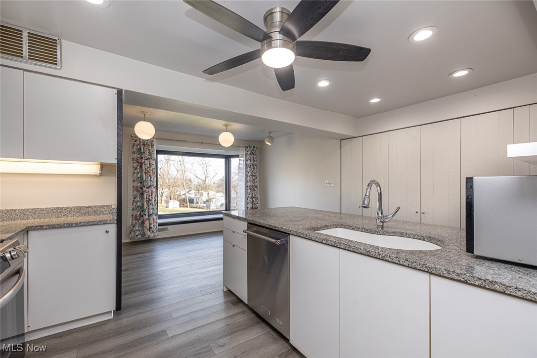 5700 Brookside Road Independence, OH 44131 - Photo 11 of 42 Kitchen featuring dishwasher and view of eat in dining area