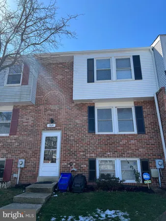 a view of house with yard