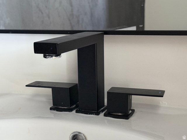 774 West 480 South American Fork, UT 84003 - Photo 26 of 76 Modern matte black three-piece faucet set featuring a rectangular spout and lever handles