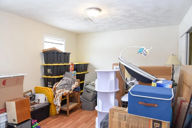 a room with furniture and wooden floor