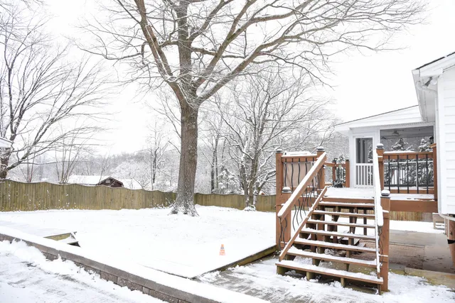 a view of a house with trees in the background