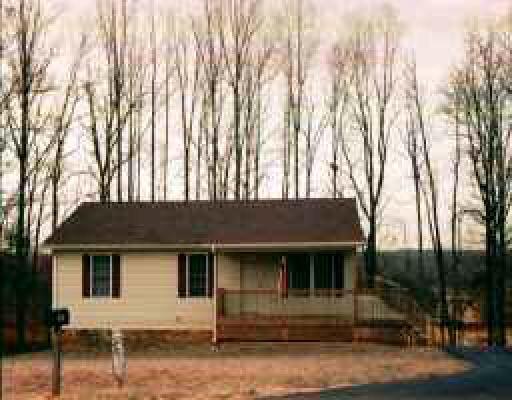 9657 Goodview Road Goodview, VA 24095 - Photo 1 of 1 front view of house with a street