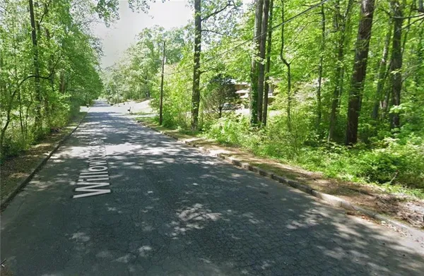 a view of a city and forest