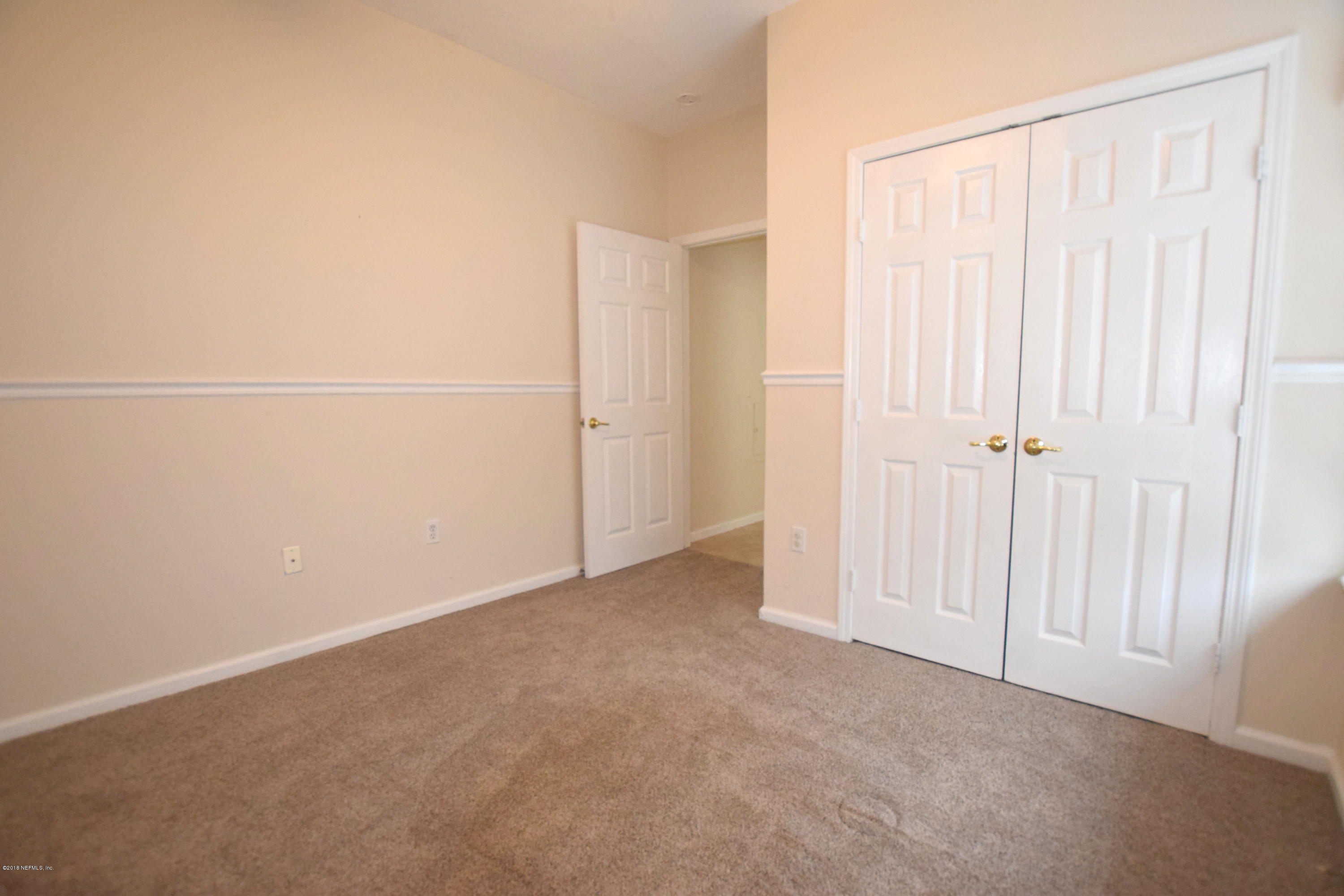 10550 Baymeadows Road, Unit 1016 Jacksonville, FL 32256 - Photo 12 of 17 an empty room with closet