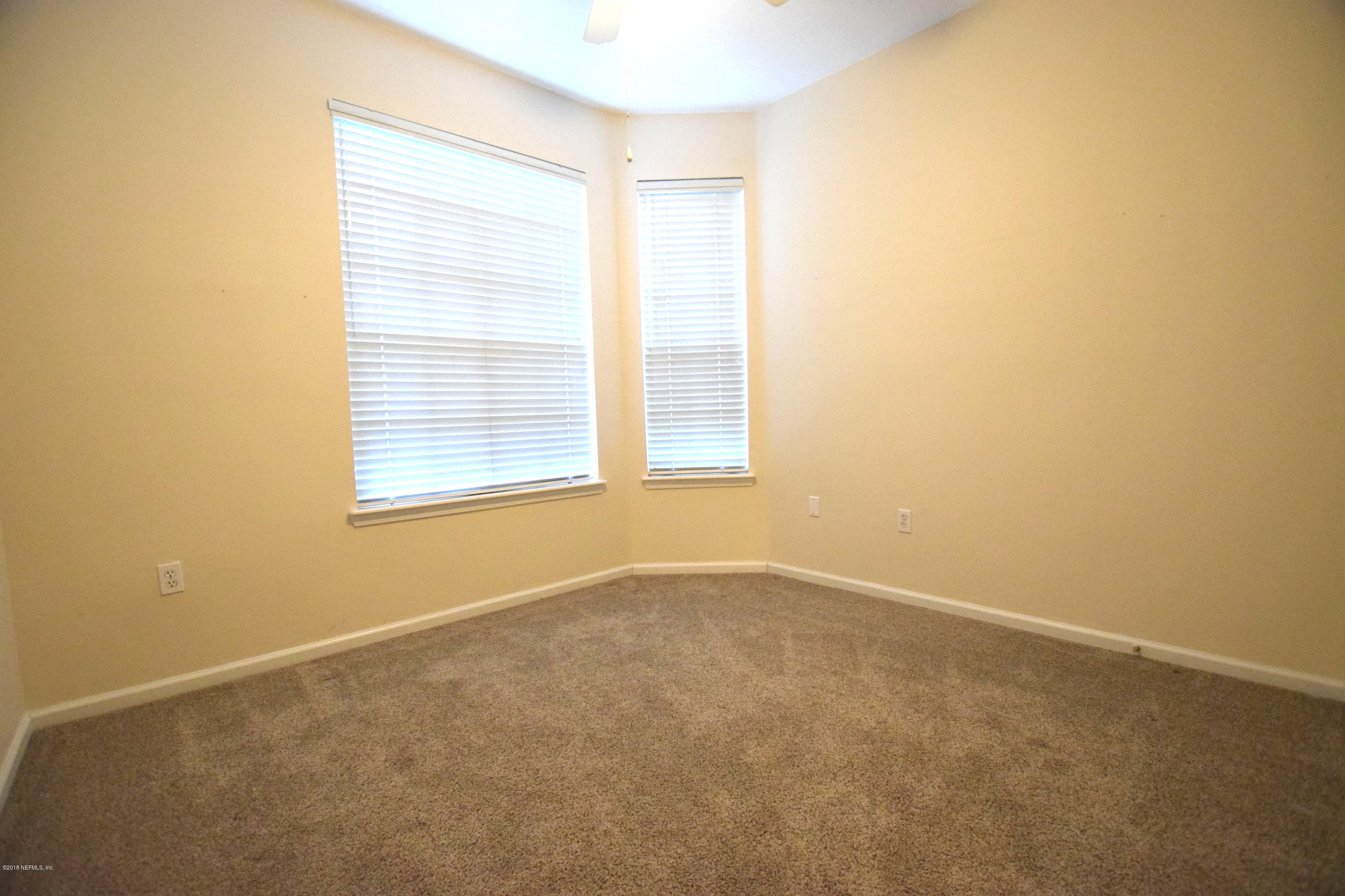 10550 Baymeadows Road, Unit 1016 Jacksonville, FL 32256 - Photo 14 of 17 an empty room with a window