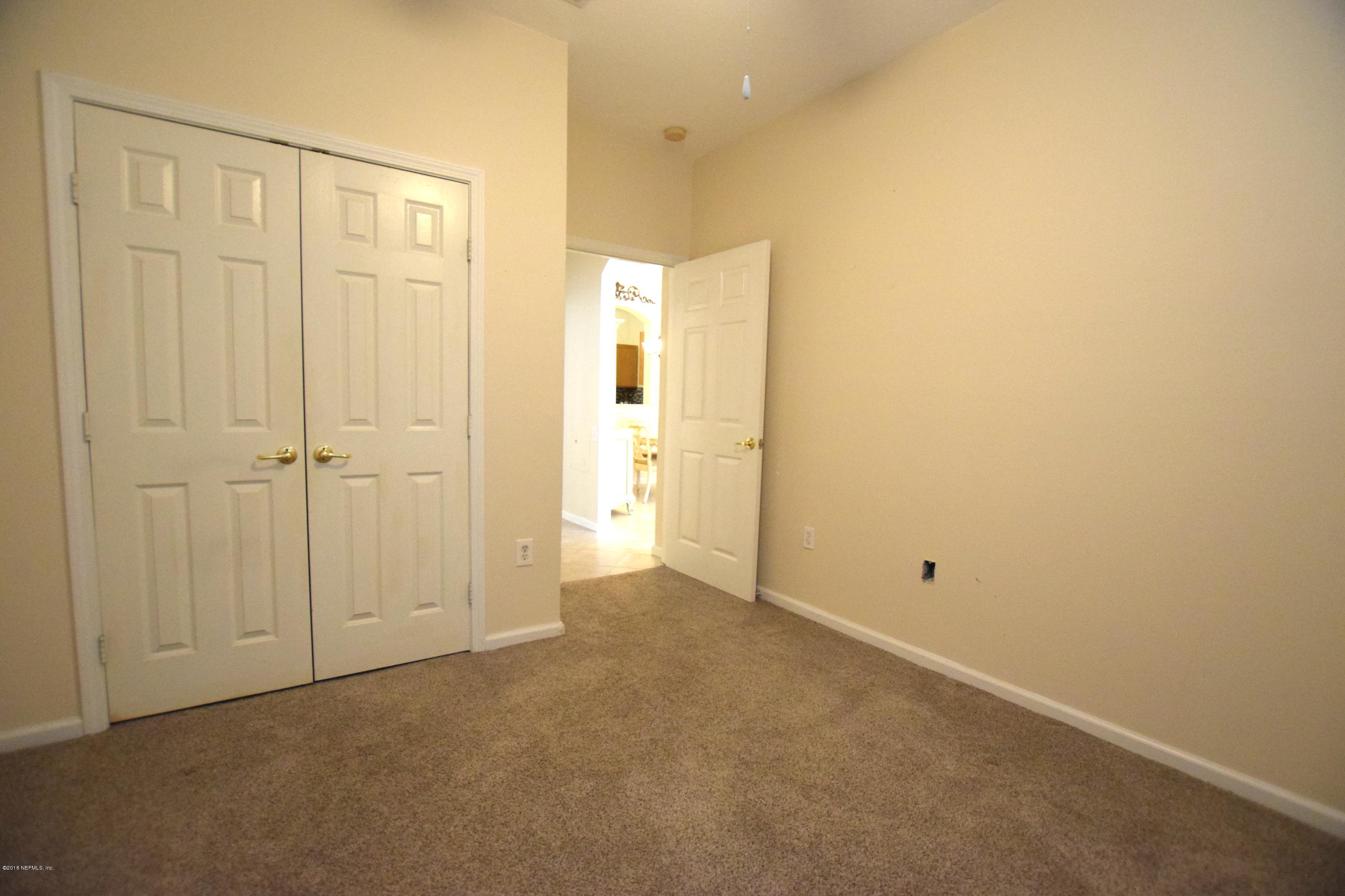 10550 Baymeadows Road, Unit 1016 Jacksonville, FL 32256 - Photo 15 of 17 an empty room with closet area