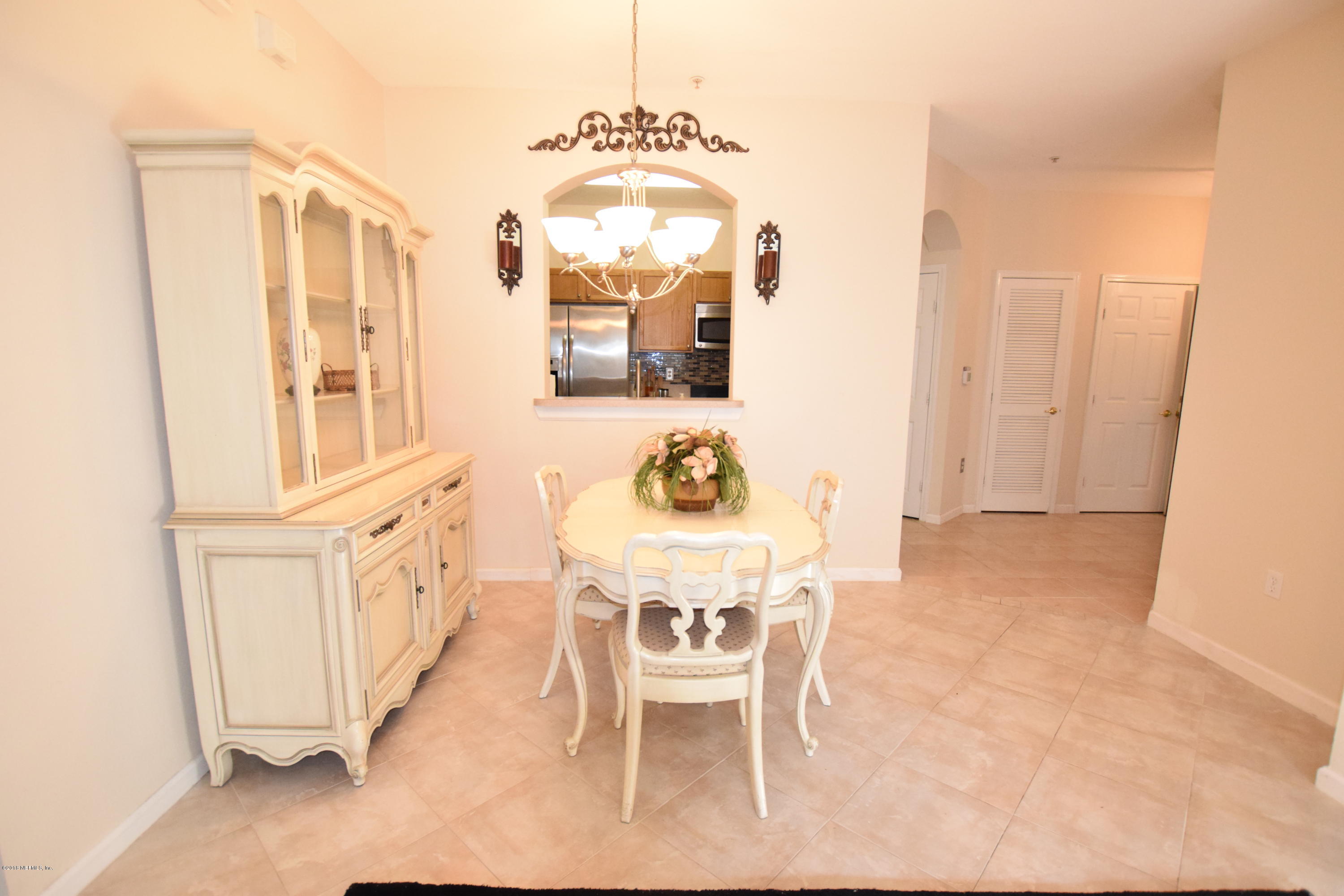10550 Baymeadows Road, Unit 1016 Jacksonville, FL 32256 - Photo 4 of 17 a view of a dining room with furniture and window
