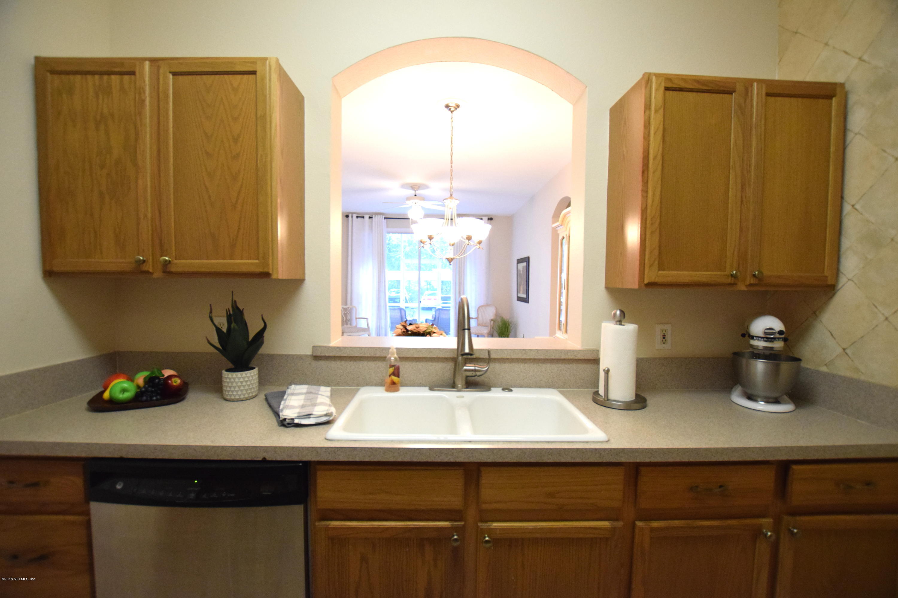 10550 Baymeadows Road, Unit 1016 Jacksonville, FL 32256 - Photo 6 of 17 a bathroom with a sink and a mirror