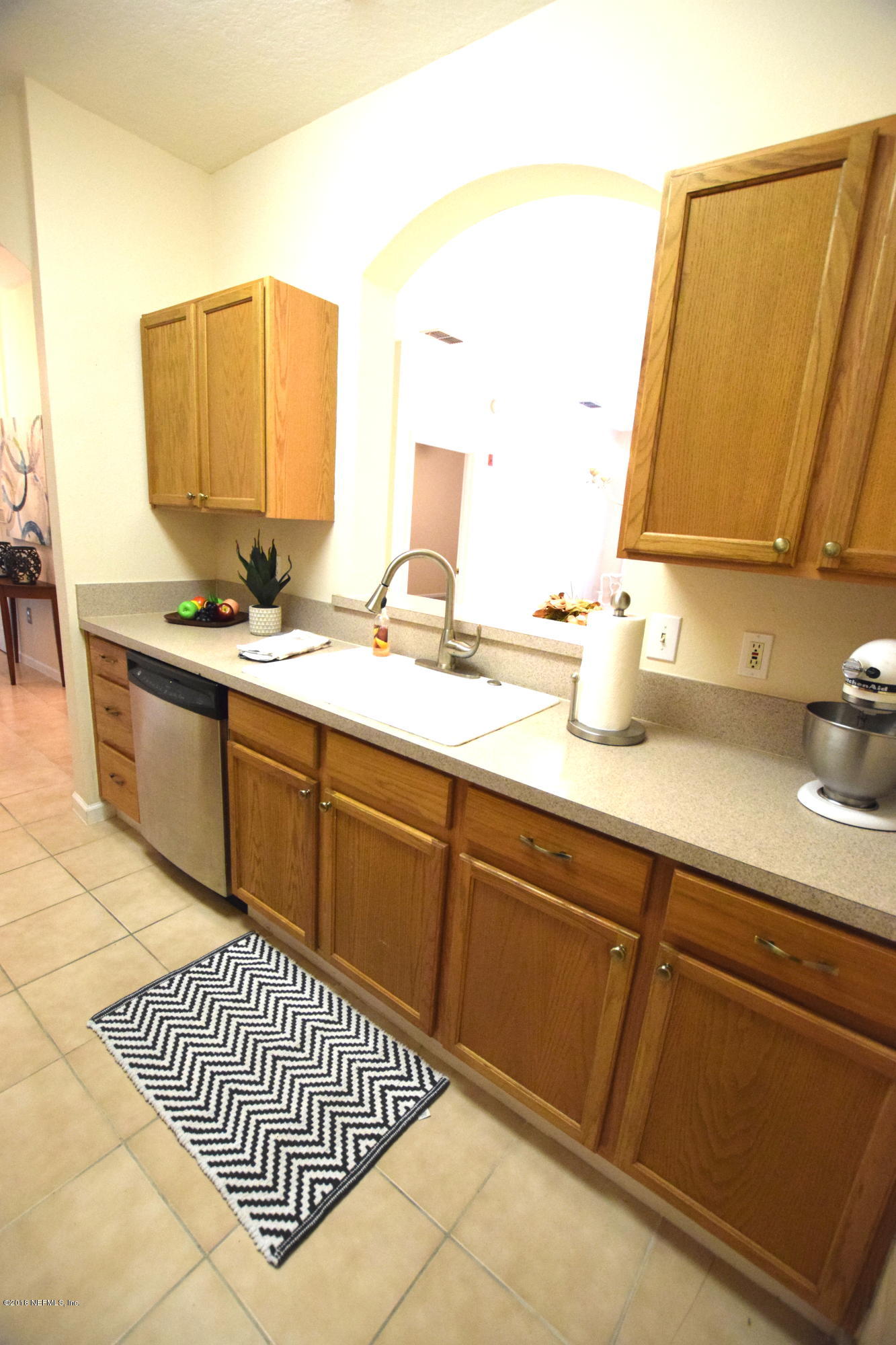 10550 Baymeadows Road, Unit 1016 Jacksonville, FL 32256 - Photo 7 of 17 a bathroom with a sink and a mirror