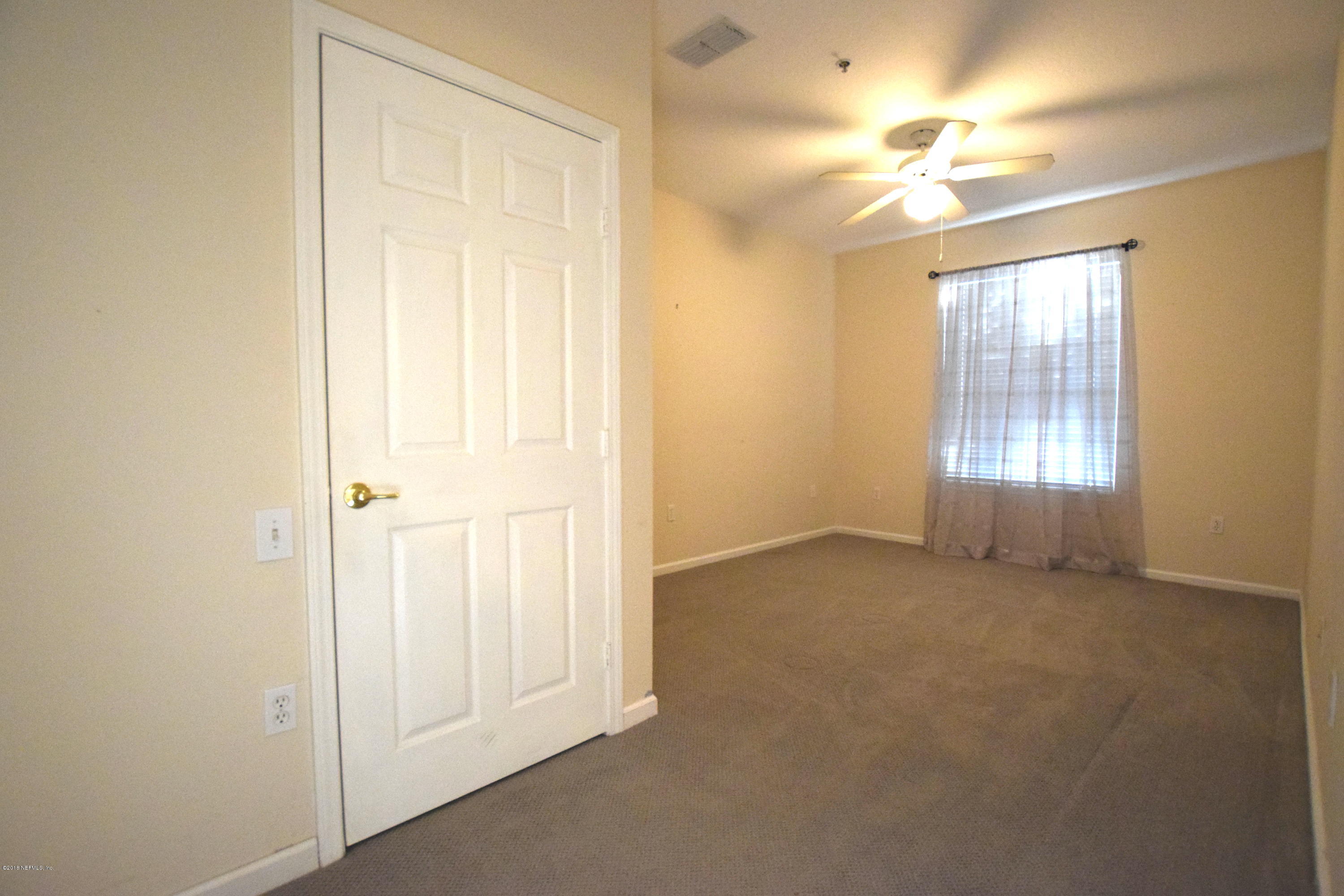 10550 Baymeadows Road, Unit 1016 Jacksonville, FL 32256 - Photo 8 of 17 a view of an empty room with a window
