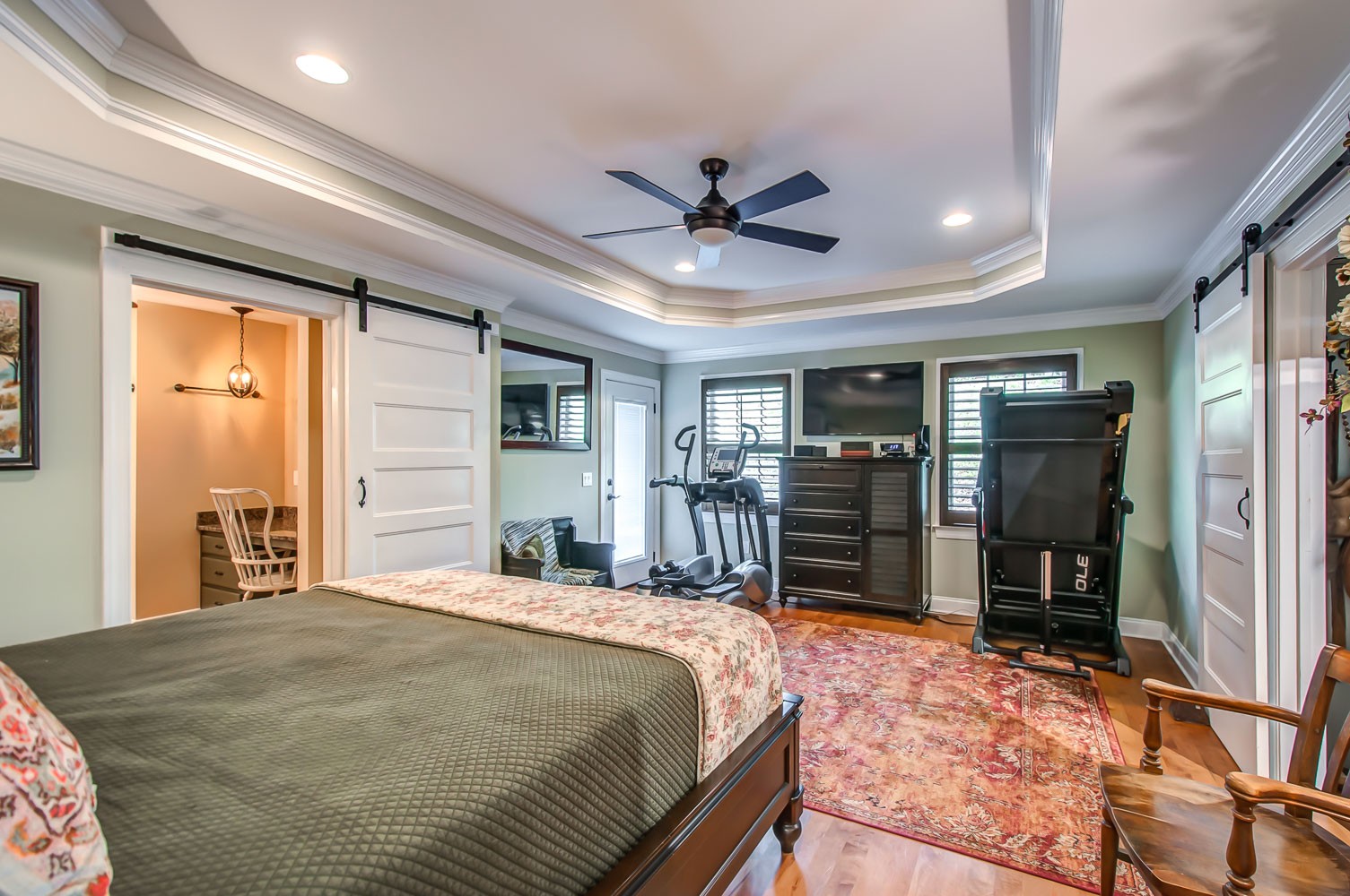 5934 Garrison Road Franklin, TN 37064 - Photo 18 of 39 a bedroom with a large bed a flat tv screen and dresser