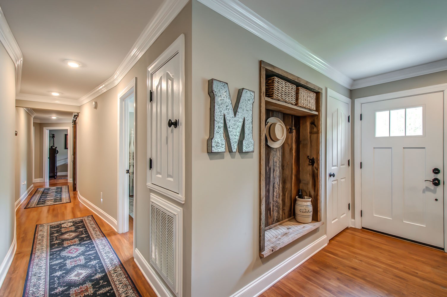 5934 Garrison Road Franklin, TN 37064 - Photo 20 of 39 a hallway with sliding door and wooden floor