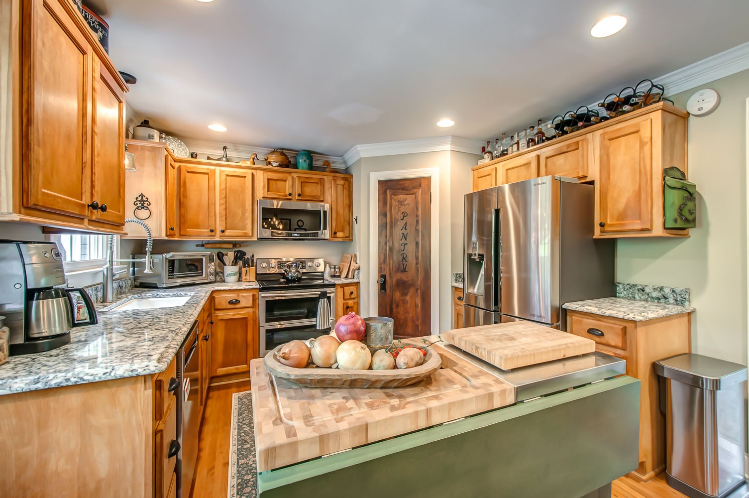 5934 Garrison Road Franklin, TN 37064 - Photo 21 of 39 a kitchen with stainless steel appliances granite countertop a sink a stove and refrigerator