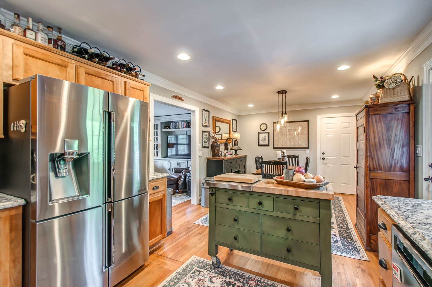 5934 Garrison Road Franklin, TN 37064 - Photo 22 of 39 a kitchen with stainless steel appliances kitchen island granite countertop a refrigerator and a sink