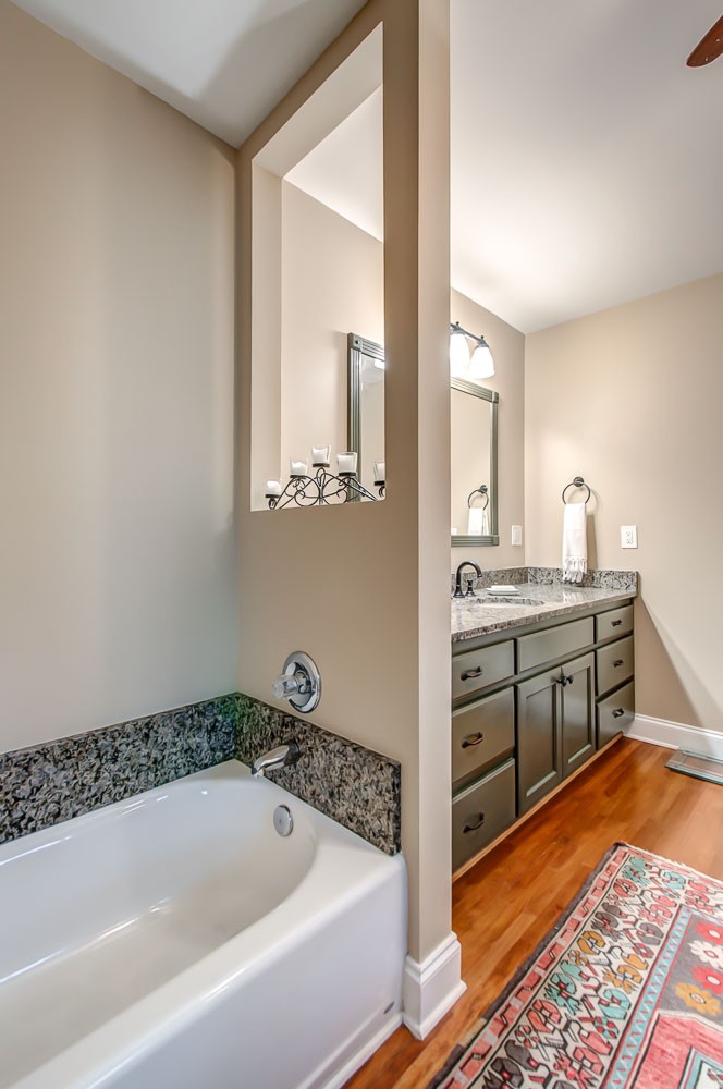 5934 Garrison Road Franklin, TN 37064 - Photo 31 of 39 a bathroom with a tub sink and mirror
