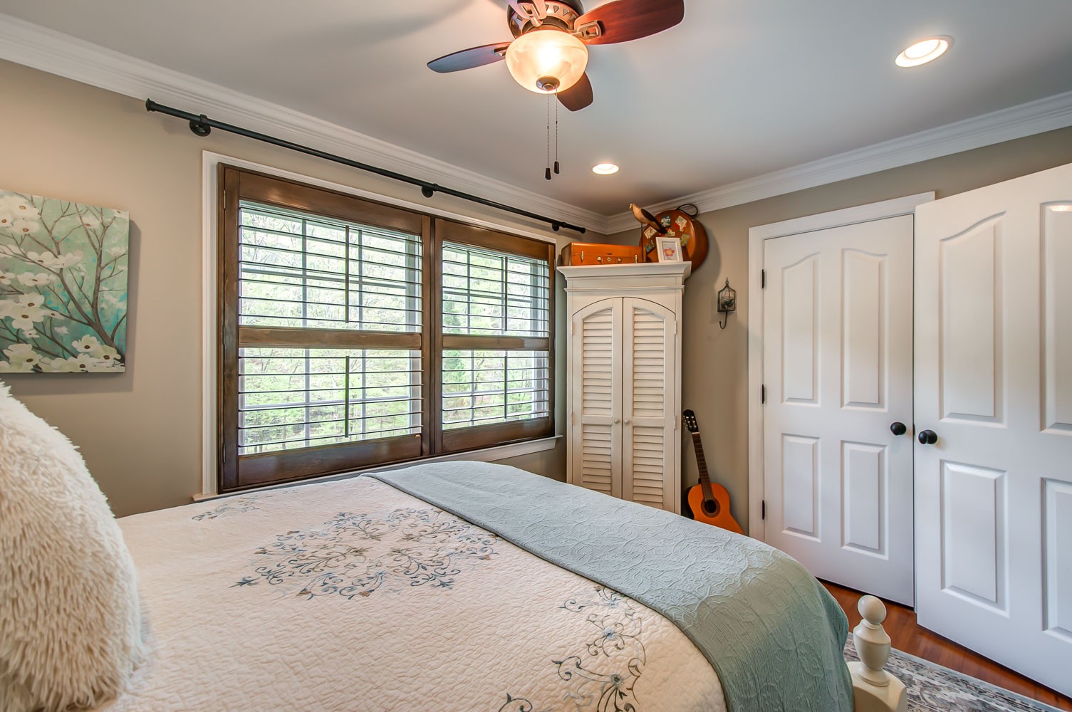 5934 Garrison Road Franklin, TN 37064 - Photo 34 of 39 a bedroom with a large bed and a chandelier