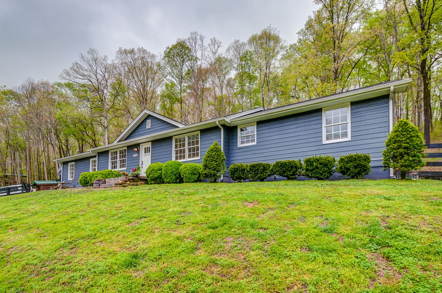 5934 Garrison Road Franklin, TN 37064 - Photo 4 of 39 a view of a house next to a big yard and large trees