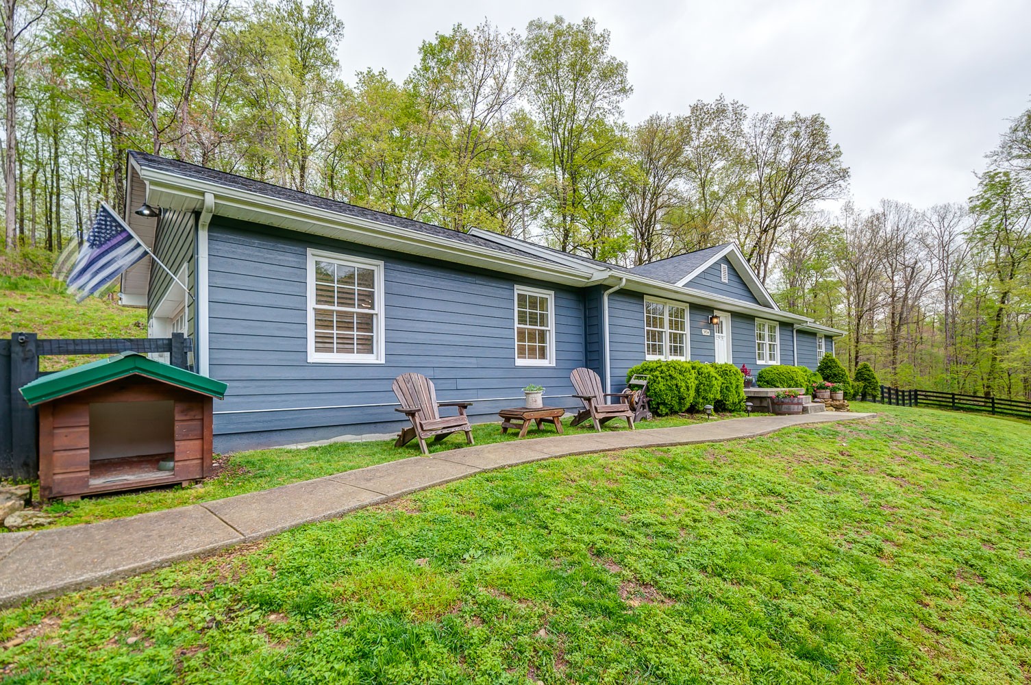 5934 Garrison Road Franklin, TN 37064 - Photo 5 of 39 a front view of a house with a yard and garage